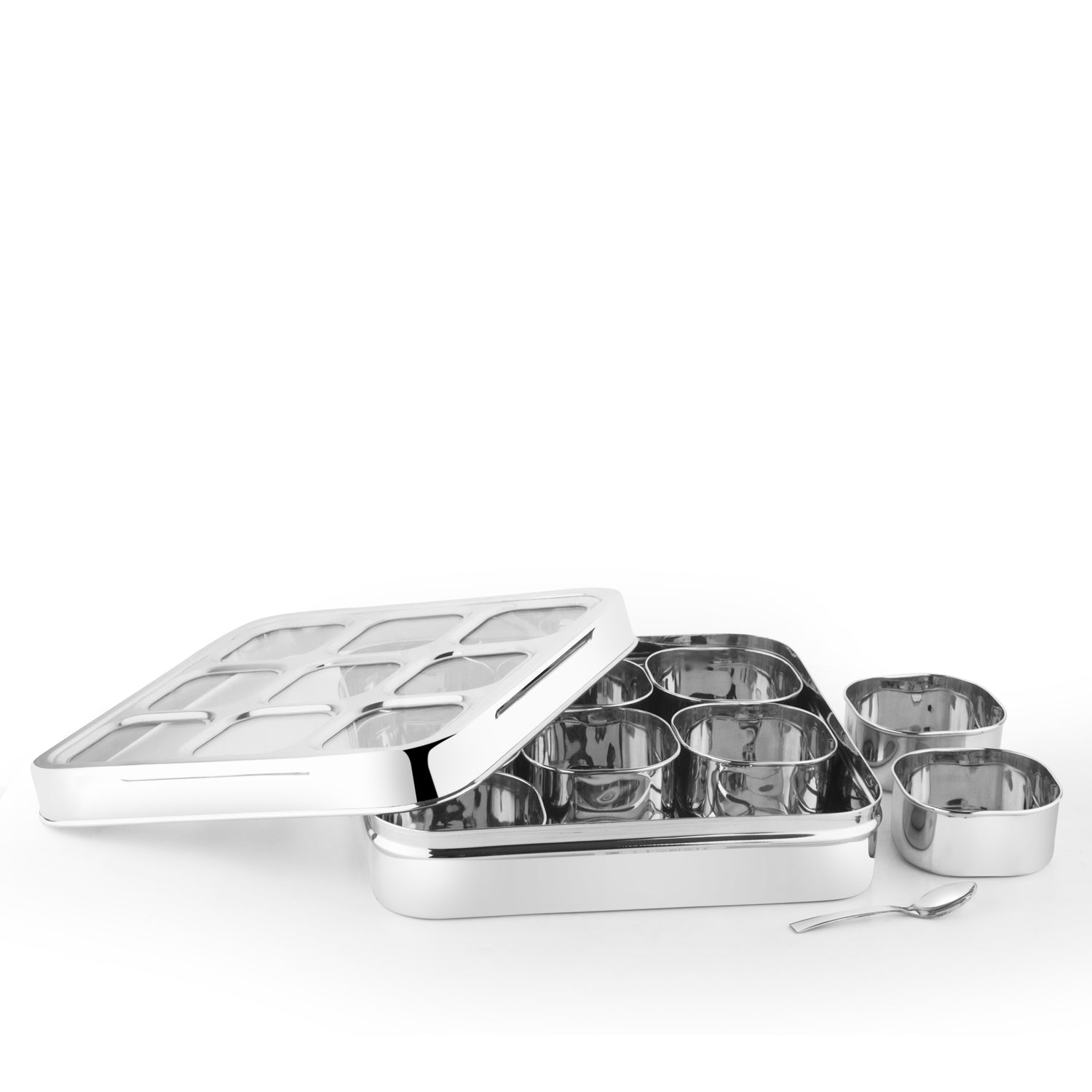 Alternate view of a square stainless steel masala box showing internal spice containers and polished steel body.