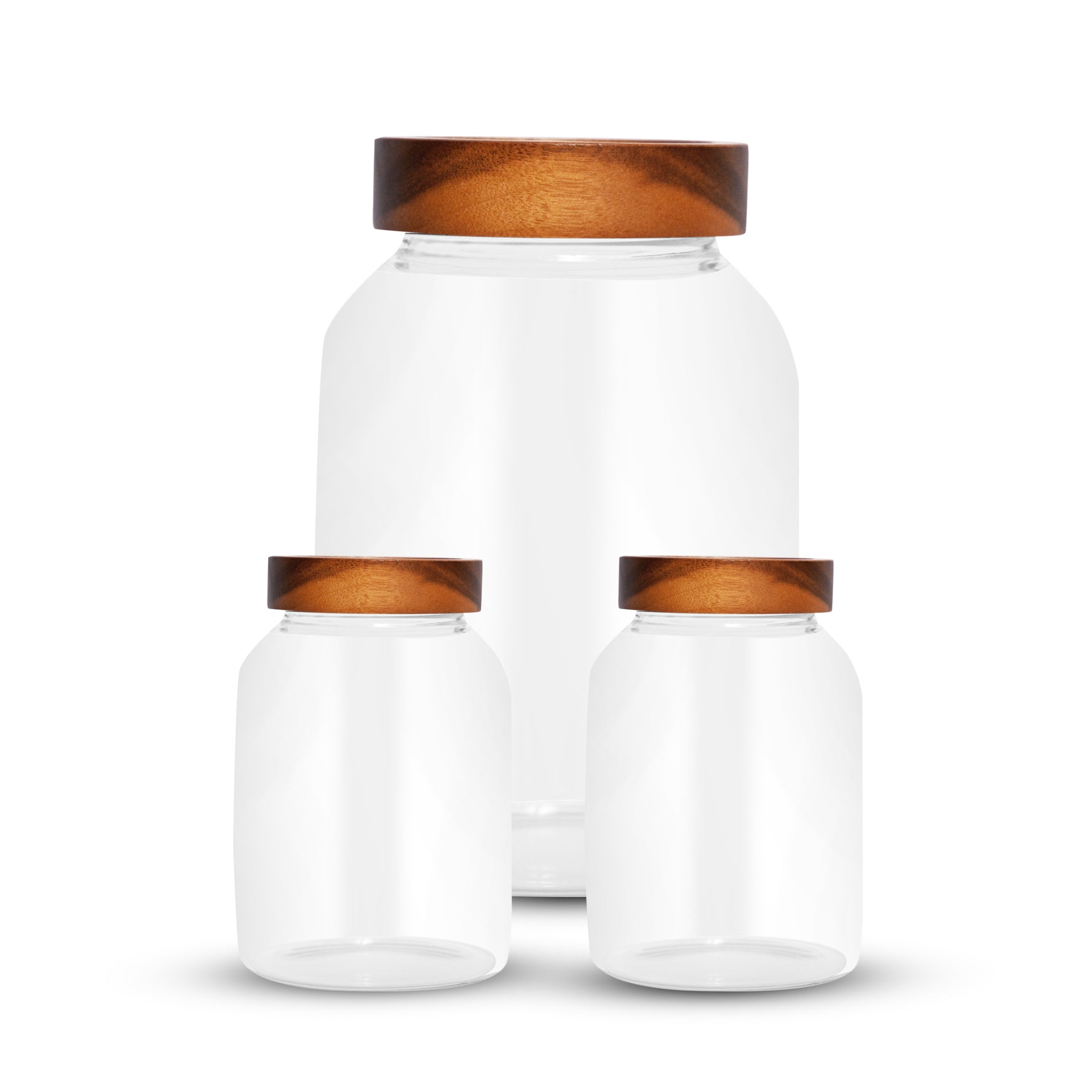 Set of three borosilicate glass jars with wooden lids by Garuda – modern, minimalist food storage containers for kitchen organization. Perfect for storing grains, spices, sugar, or snacks.